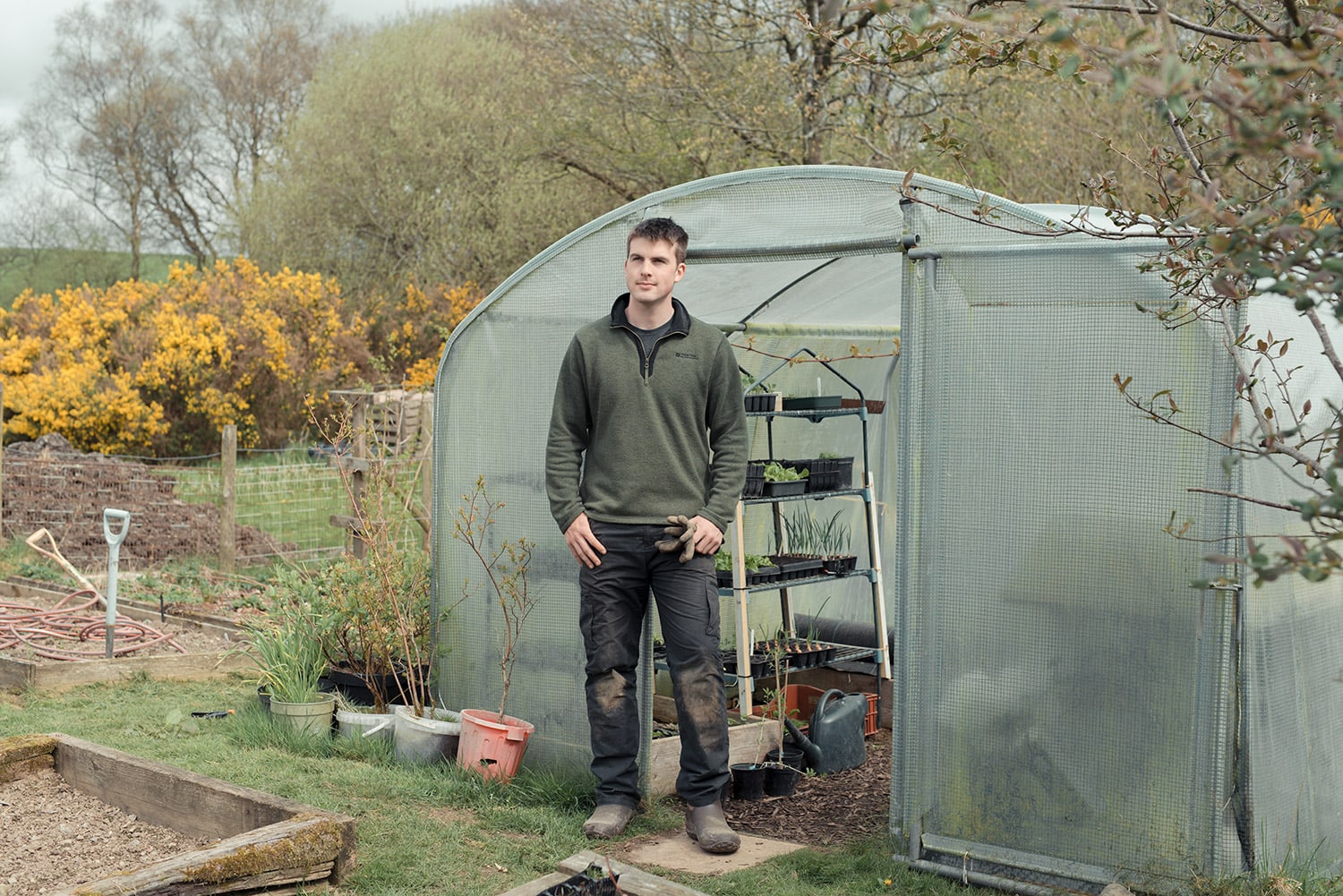 Huw Richards photographed for the Guardian Weekend in his vegetable garden in Tregaron, Wales
